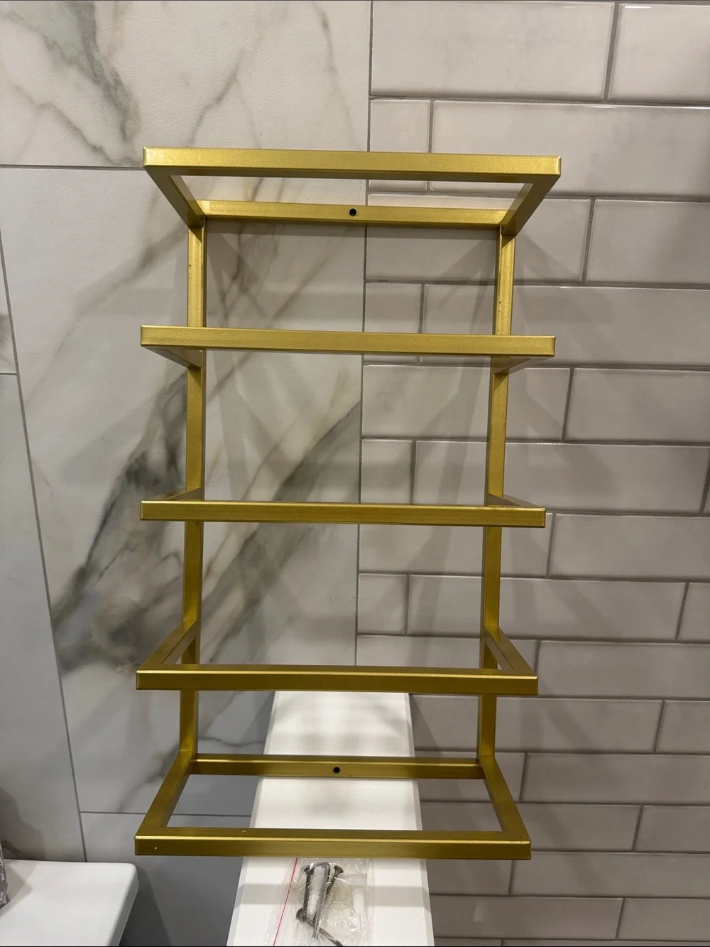 Gold Wall-Mounted Towel Rack with Green and Beige Towels - Modern Bath Storage